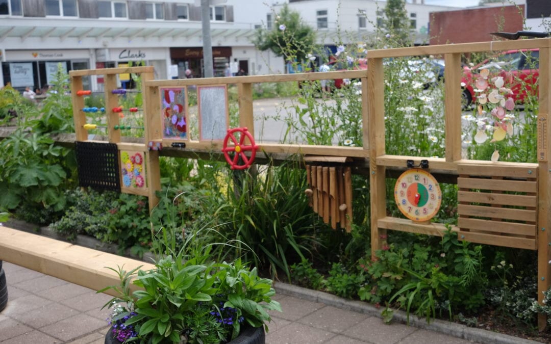 Talisman transformed with flowers, art and benches